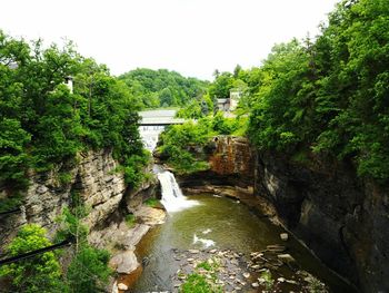 Scenic view of river flowing through rocks