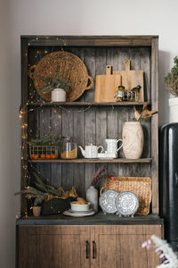 Wooden cabinet and kitchen utensils, dishes and christmas decor for new year