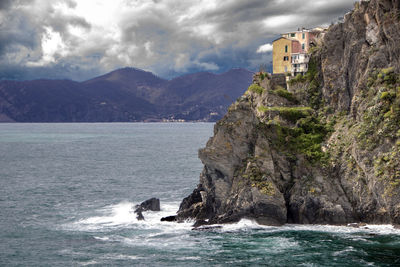 Scenic view of sea and rocks against sky