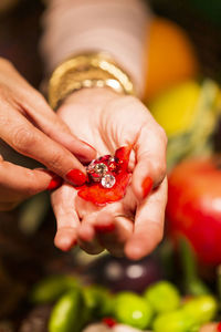 Close-up of hand holding strawberry