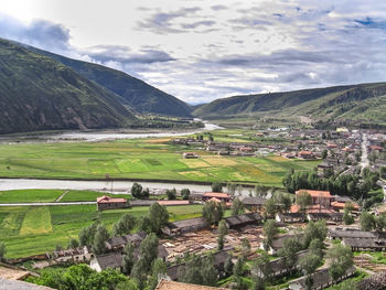 Tibetan village with houses and cultivation land