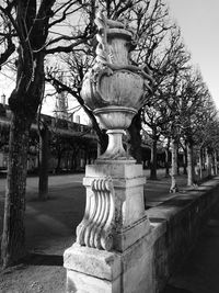 Statue in park against sky