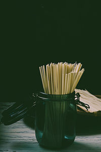 Close-up of drink on table against black background