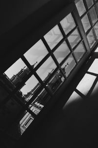 Low angle view of building seen through window