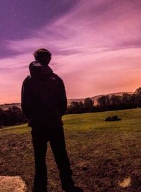 Scenic view of field against sky at sunset