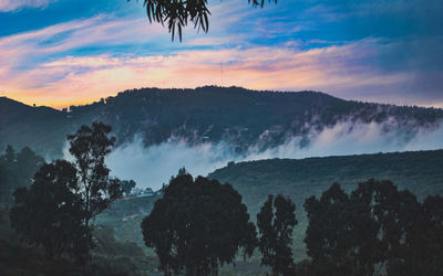 Scenic view of silhouette mountain against sky during sunset