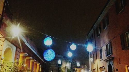 Low angle view of illuminated city at night