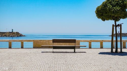 Scenic view of beach against clear sky