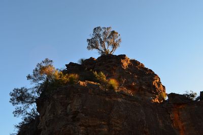 Low angle view of rock formation against sky