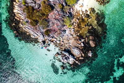 High angle view of rocks in sea