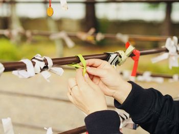 Close-up of person holding umbrella