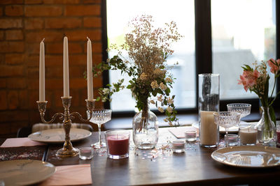 Flower vase on table in restaurant