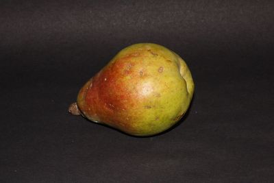 Close-up of apple against black background