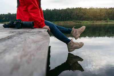 Low section of man standing on rock