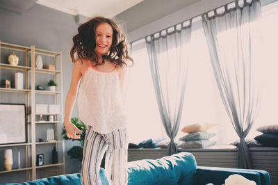 Portrait of girl standing at home