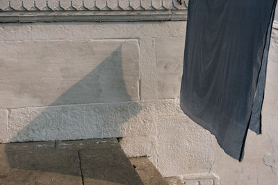 Low angle view of shadow on wall