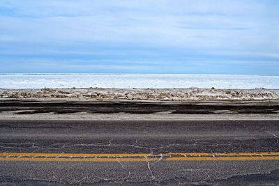 Road against cloudy sky