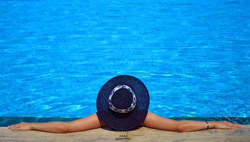 High angle view of woman swimming in pool