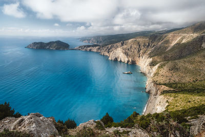 High angle view of sea and rocks against sky