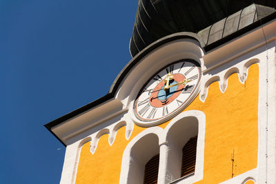 Low angle view of building against clear blue sky