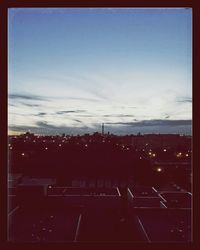 Cityscape against cloudy sky