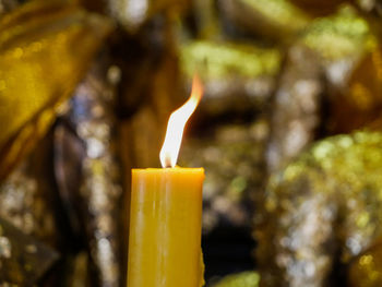 Close-up of burning candle