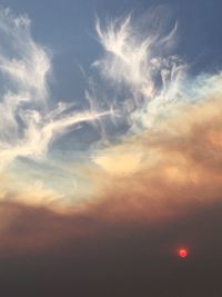 Low angle view of cloudy sky during sunset
