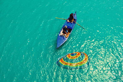 High angle view of people fishing in sea