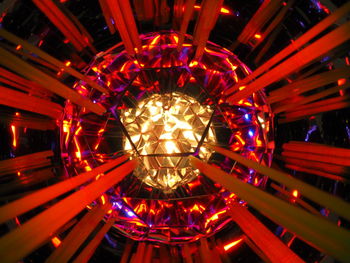 Low angle view of illuminated lights hanging from ceiling