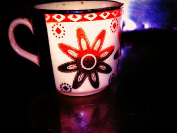 Close-up of coffee cup on table