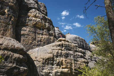 Low angle view of rock formations against sky