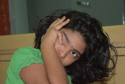 Close-up portrait of girl at home