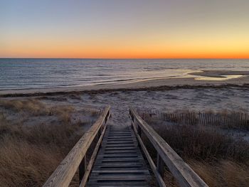 Scenic view of sea against clear sky during sunset