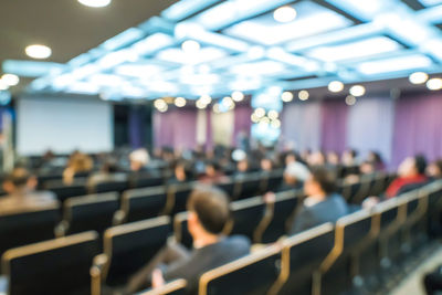 People sitting on chair in seminar