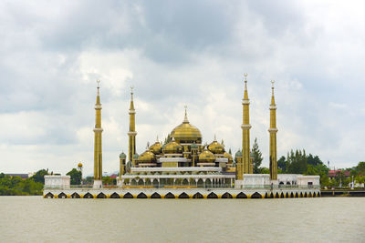 View of temple against cloudy sky