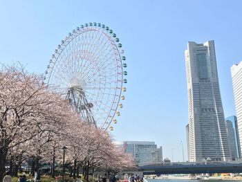 Low angle view of ferris wheel against sky