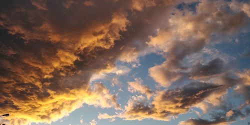 Low angle view of clouds in sky during sunset