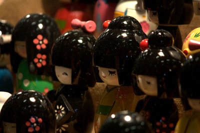 Close-up of kokeshi dolls in shop