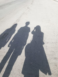 Shadow of couple on road