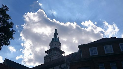 Low angle view of built structure against cloudy sky