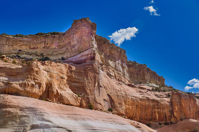 View of rock formation against blue sky