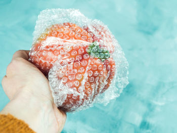 Close-up of hand holding ice cream