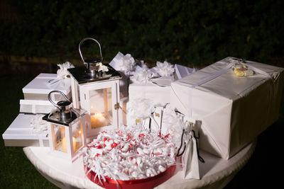 Close-up of gift boxes on table at night