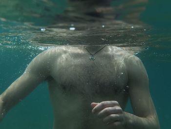 Man swimming in sea