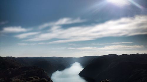 Scenic view of waterfall against sky