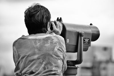 Woman photographing through camera