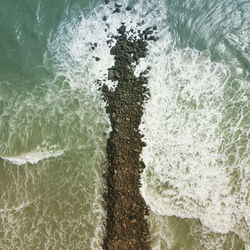 High angle view of surf on beach