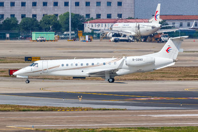 Side view of airplane on airport runway