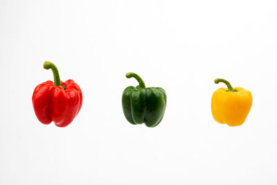 Close-up of bell peppers against white background