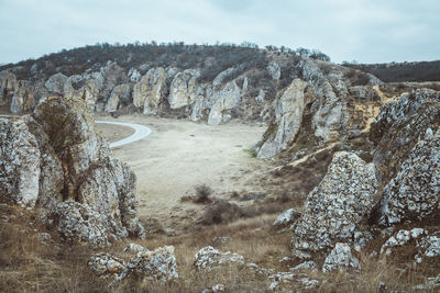 View of rock formations against sky